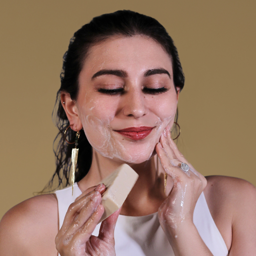 Woman using Organic Turmeric Brightening Soap