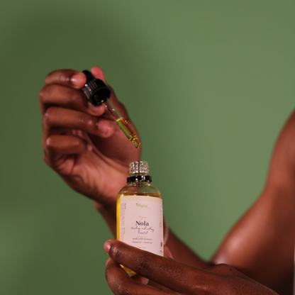 Nola Face Oil texture - lightweight organic facial oil absorption