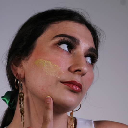 Woman applying Even Skin Glow Mask - natural brightening facial treatment